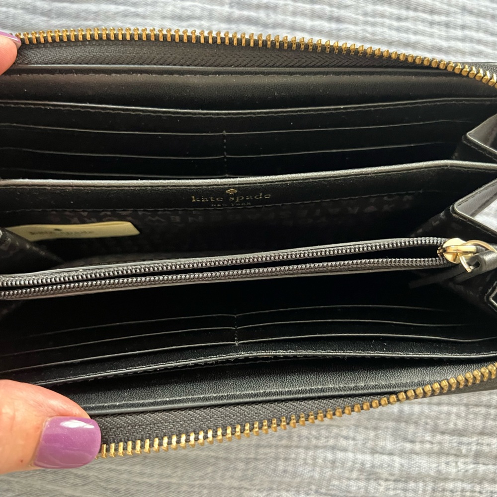 Beautiful black pebbled leather wallet—almost brand new. Tons of space for cards